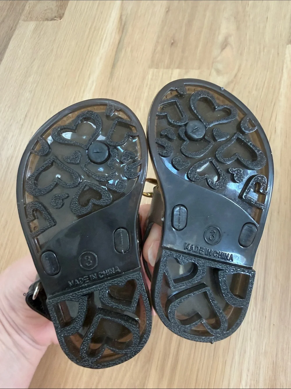 Rising Star Black Sandals with Gold Bow and Striped Footbed